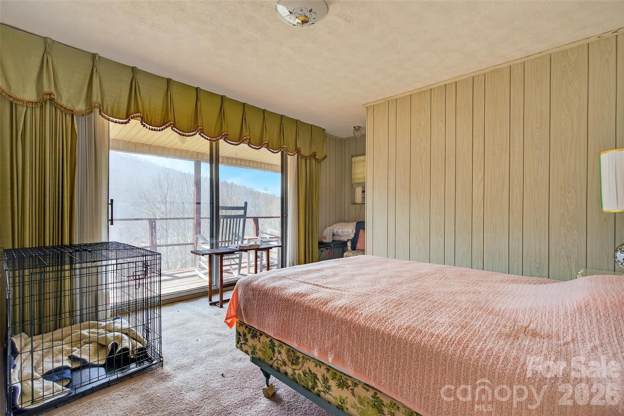1306 Fork Mountain Road Bakersville, NC 28705 - Photo 14 of 34 a bedroom with a bed and a window