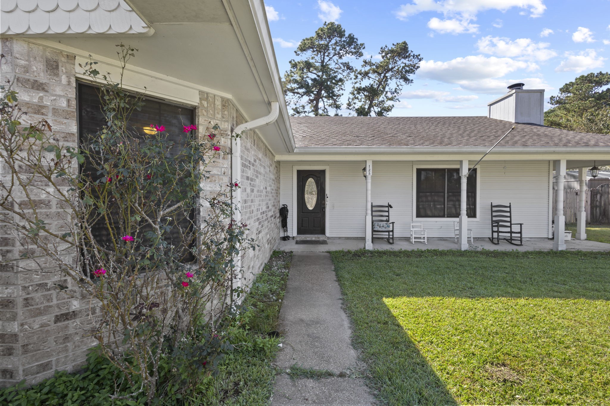 a front view of a house with garden