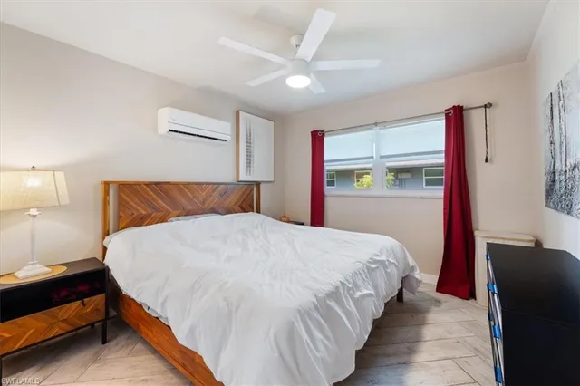 a bedroom with a bed and dresser