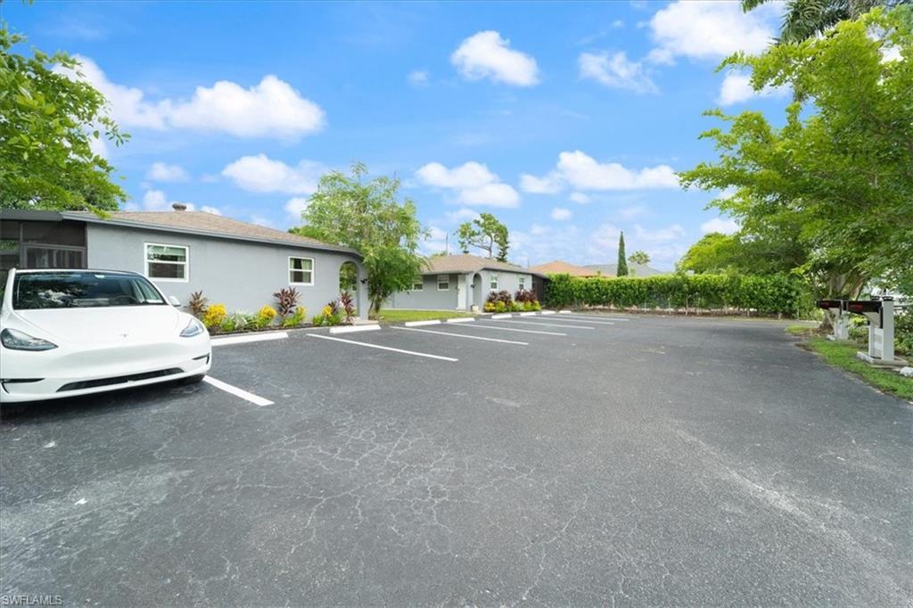 3365-3367 Estey Avenue Naples, FL 34104 - Photo 2 of 30 a car parked on the side of the road