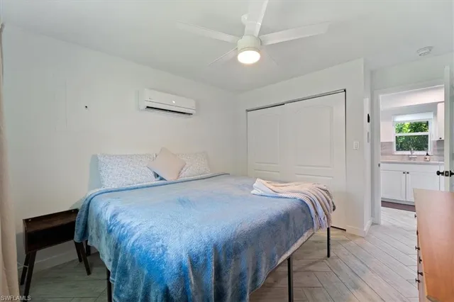 a bedroom with a bed and a table