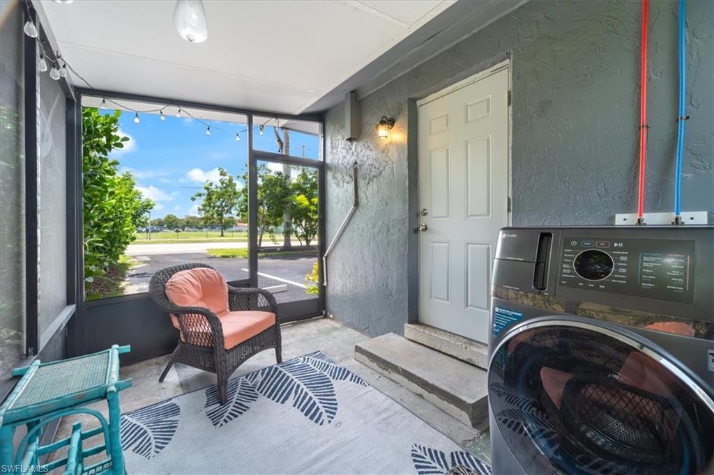 3365-3367 Estey Avenue Naples, FL 34104 - Photo 26 of 30 a view of a livingroom with furniture and a fireplace