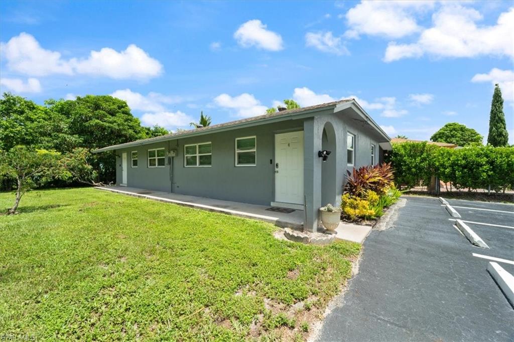 3365-3367 Estey Avenue Naples, FL 34104 - Photo 29 of 30 a front view of a house with garden