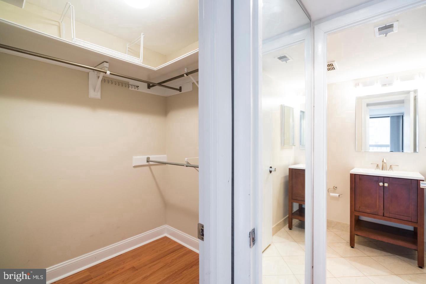 1140 23rd Street Northwest, Unit 707 Washington, DC 20037 - Photo 9 of 18 Spacious closet and modern bath suite.