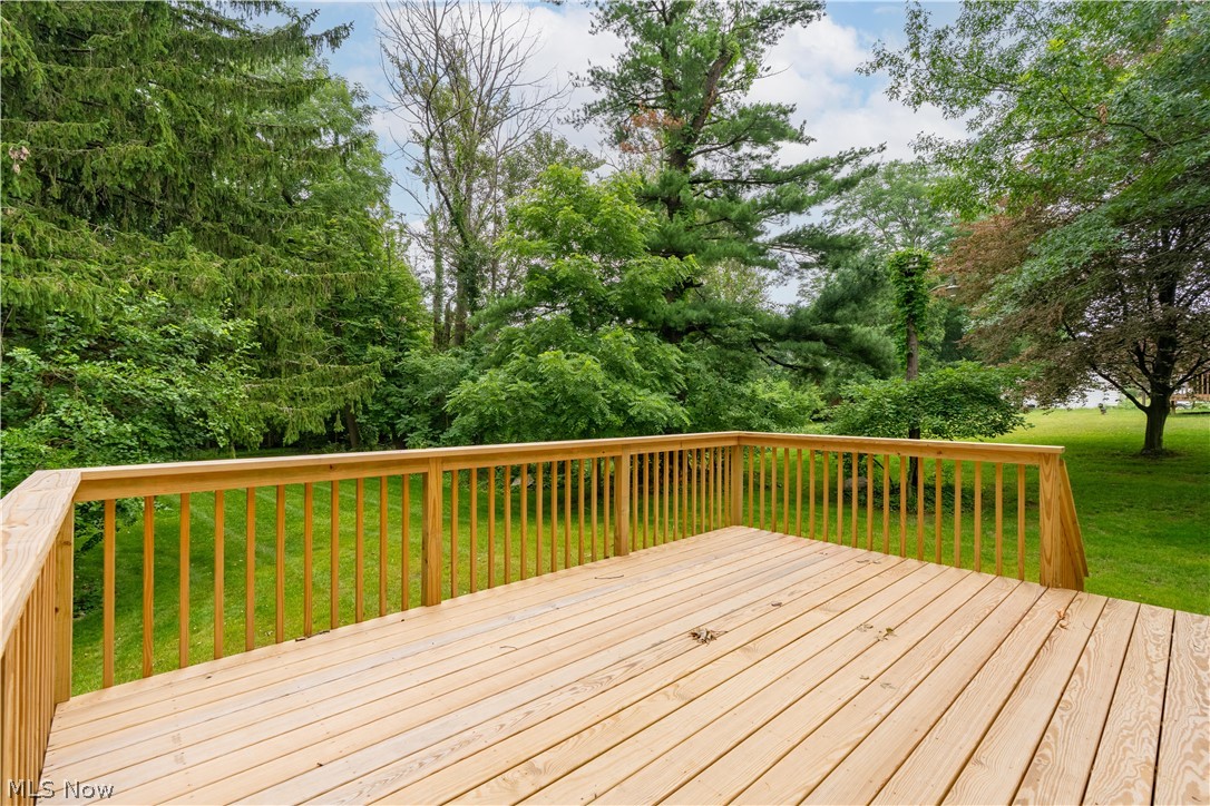 7876 Burkey Road Northwest North Canton, OH 44720 - Photo 30 of 40 A great deck off the back overlooking beautiful trees.