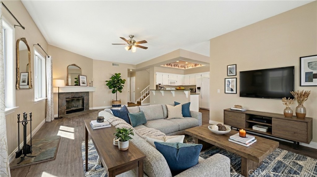 22678 Weatherly Court Wildomar, CA 92595 - Photo 11 of 54 Open Living Area With Fireplace And Wood Style Flooring - Digitally Staged