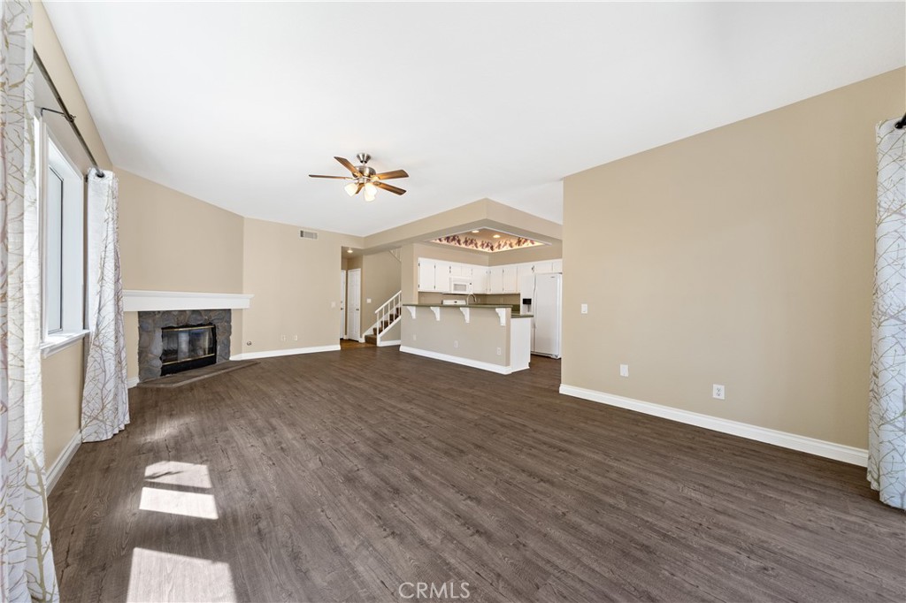 22678 Weatherly Court Wildomar, CA 92595 - Photo 12 of 54 Open Living Area With Fireplace And Wood Style Flooring