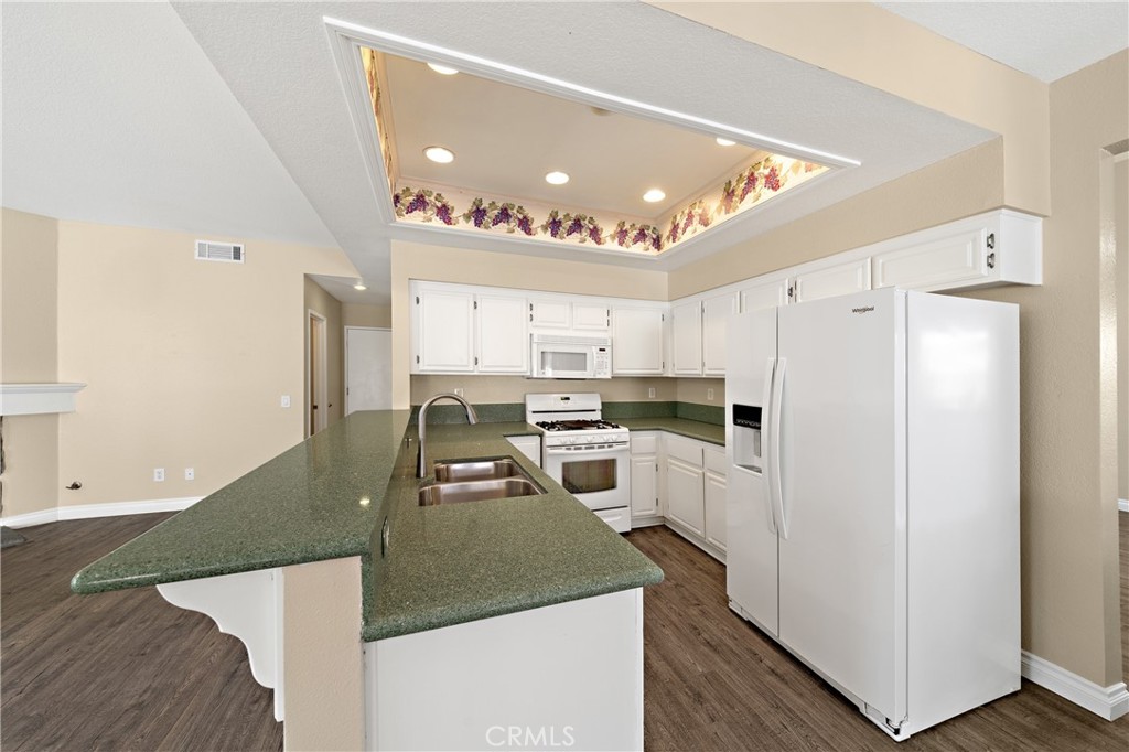 22678 Weatherly Court Wildomar, CA 92595 - Photo 15 of 54 Functional Kitchen Layout With Plenty Of Cabinetry And Natural Light