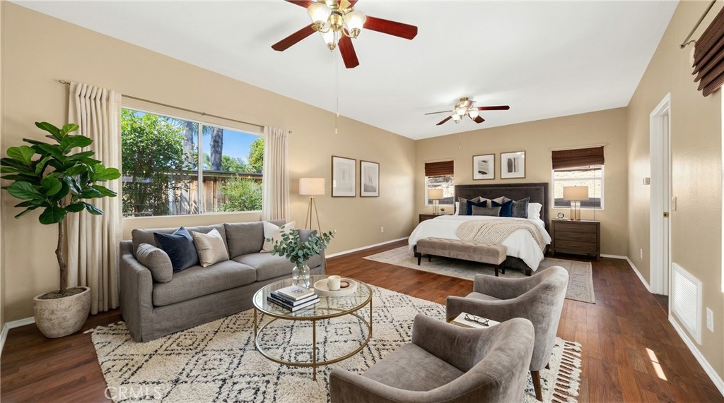 22678 Weatherly Court Wildomar, CA 92595 - Photo 17 of 54 Spacious Downstairs Primary Bedroom With Ceiling Fan And Wood-Look Flooring - Digitally Staged
