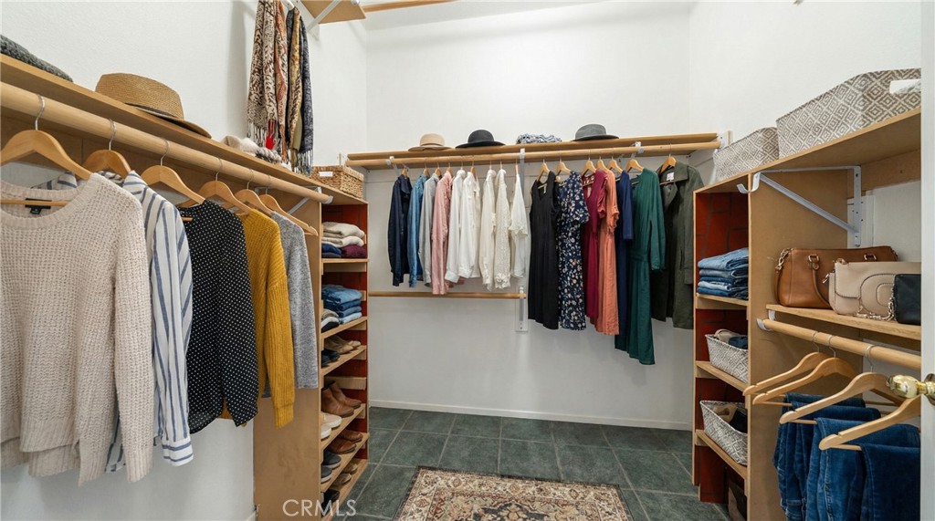 22678 Weatherly Court Wildomar, CA 92595 - Photo 23 of 54 Walk-In Closet With Built-In Shelving And Organized Storage - Digitally Staged