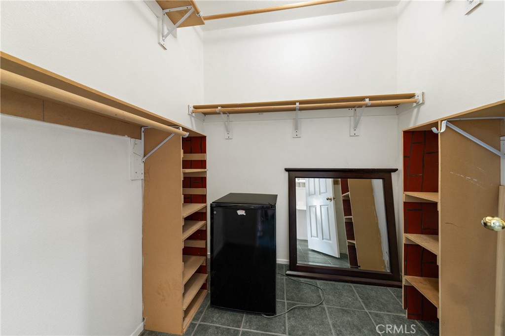 22678 Weatherly Court Wildomar, CA 92595 - Photo 24 of 54 Walk-In Closet With Built-In Shelving And Organized Storage