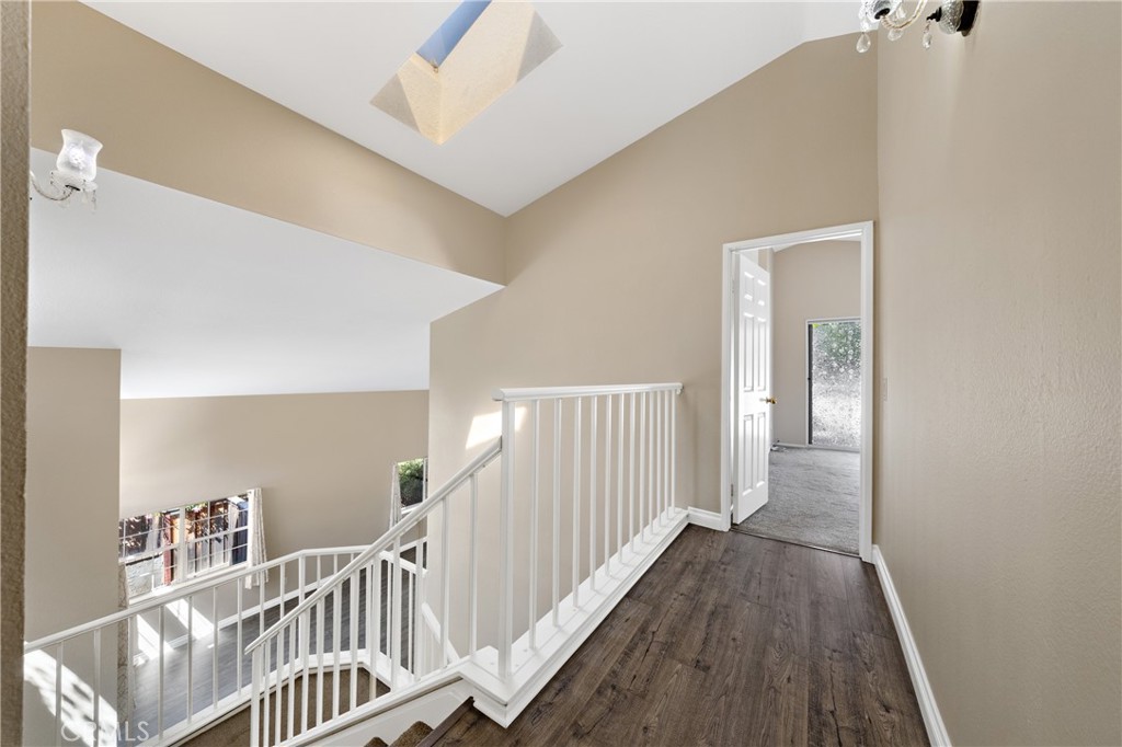 22678 Weatherly Court Wildomar, CA 92595 - Photo 25 of 54 Open Staircase And Hallway With Vaulted Ceilings And Natural Light