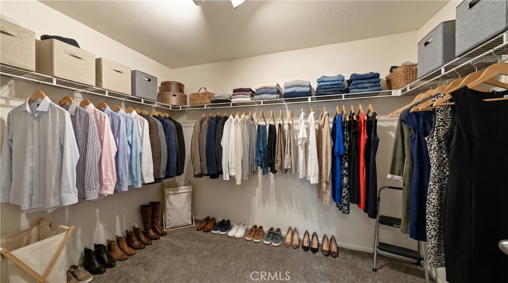 22678 Weatherly Court Wildomar, CA 92595 - Photo 31 of 54 Spacious Walk-In Closet With Wraparound Hanging Space - Digitally Staged