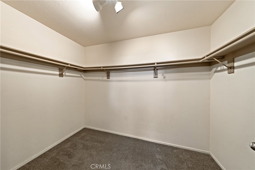 22678 Weatherly Court Wildomar, CA 92595 - Photo 32 of 54 Spacious Walk-In Closet With Wraparound Hanging Space