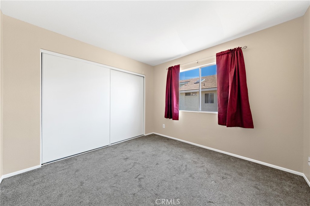 22678 Weatherly Court Wildomar, CA 92595 - Photo 38 of 54 Upstairs Bedroom With Window, Natural Light, And Closet Space