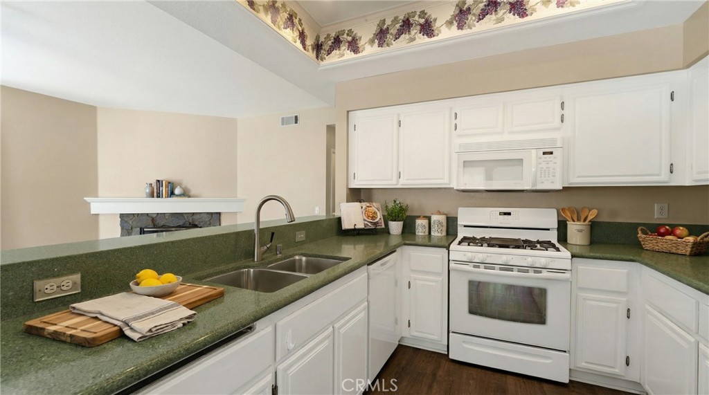 22678 Weatherly Court Wildomar, CA 92595 - Photo 4 of 54 Bright Kitchen With Recessed Lighting And Generous Countertops - Digitally Staged