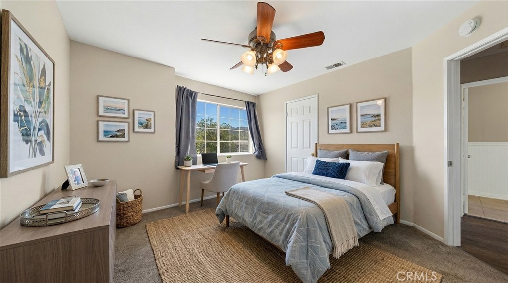 22678 Weatherly Court Wildomar, CA 92595 - Photo 41 of 54 Upstairs Bedroom With Ceiling Fan, Natural Light, And Neutral Finishes - Digitally Staged