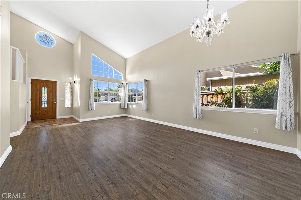 22678 Weatherly Court Wildomar, CA 92595 - Photo 6 of 54 Bright Living Room With Vaulted Ceilings, Large Windows, And Wood-Look Flooring