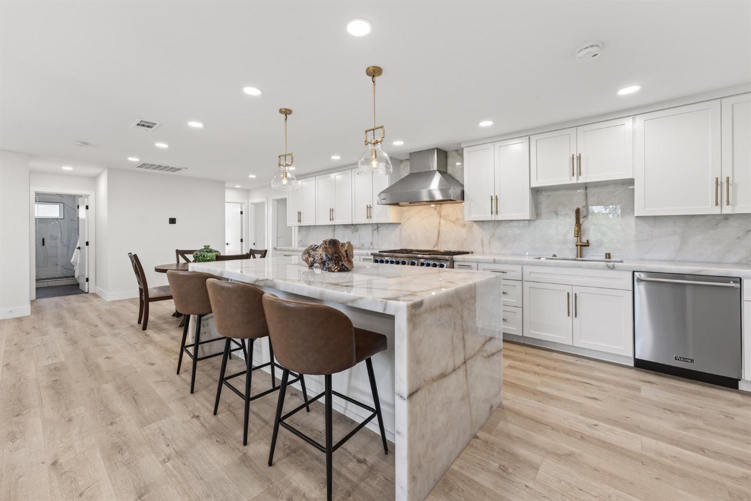 1543 Rancho View Drive Lafayette, CA 94549 - Photo 11 of 86 a kitchen with stainless steel appliances kitchen island granite countertop a stove a sink a refrigerator and white cabinets with wooden floor