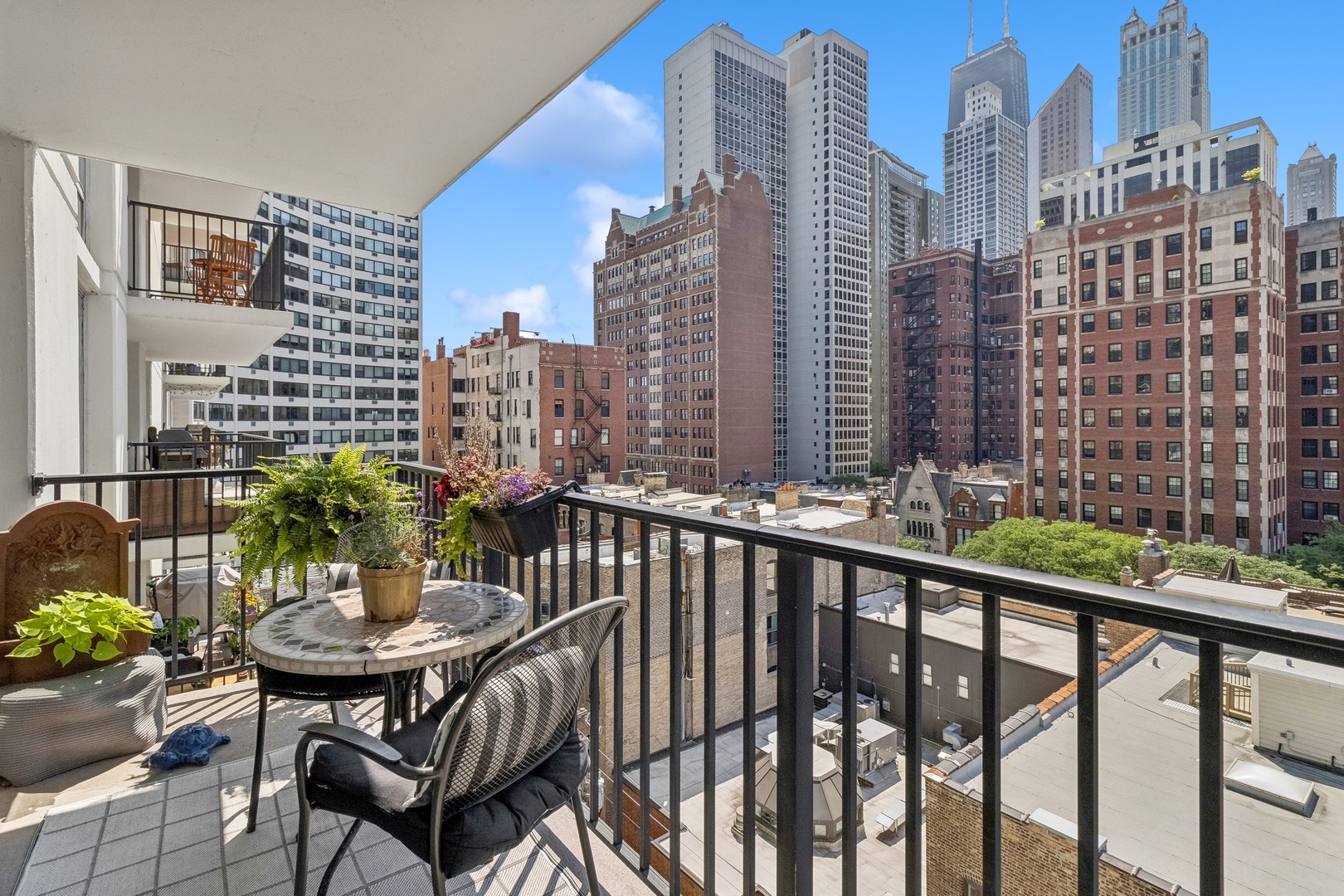71 East Division Street, Unit 906 Chicago, IL 60611 - Photo 13 of 20 a view of a balcony with chairs