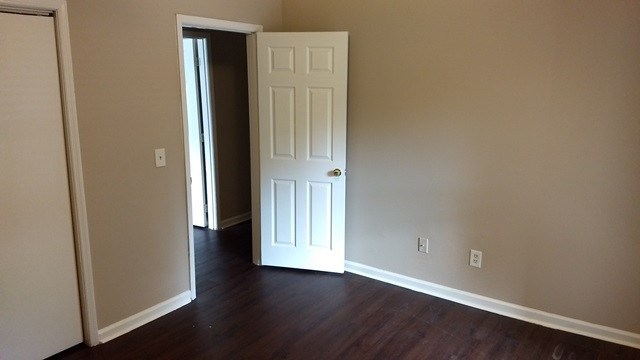 6233 Cross Tie Court Columbus, GA 31909 - Photo 3 of 7 an empty room with wooden floor and windows
