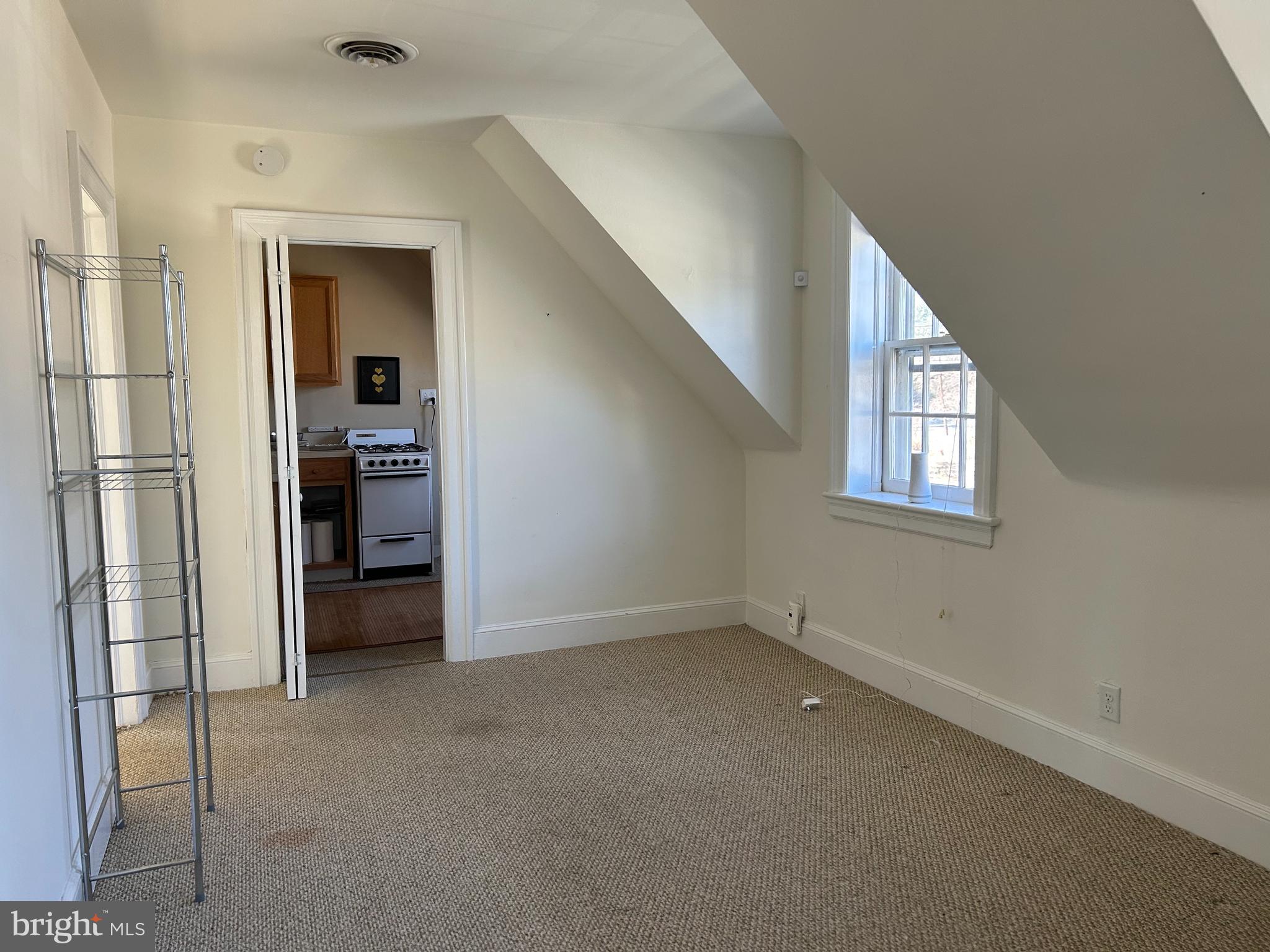 265 Moore Street, Unit 2 Princeton, NJ 08540 - Photo 2 of 7 an empty room with windows and cabinet