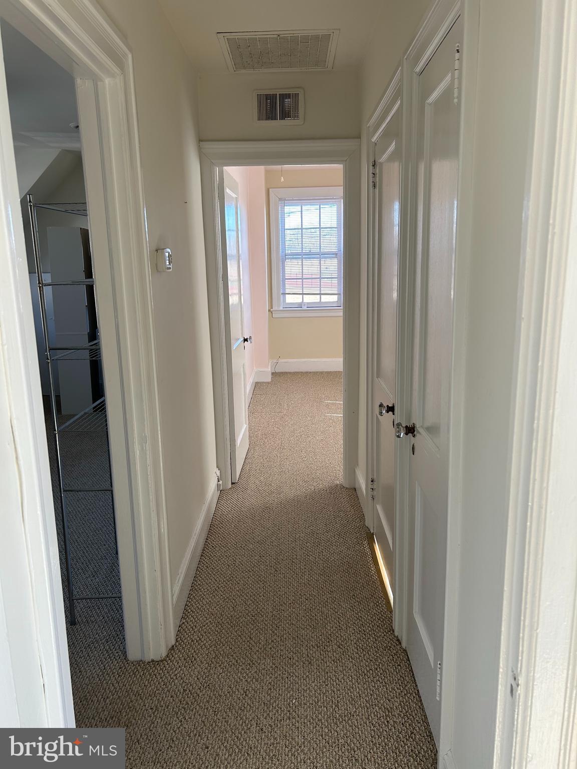 265 Moore Street, Unit 2 Princeton, NJ 08540 - Photo 7 of 7 a view of a hallway with wooden floor and closet