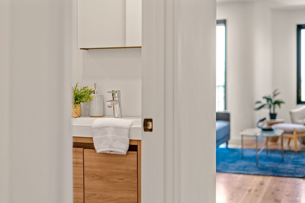 191 Condor Street, Unit 6 Boston, MA 02128 - Photo 11 of 14 a living room with furniture and wooden floor