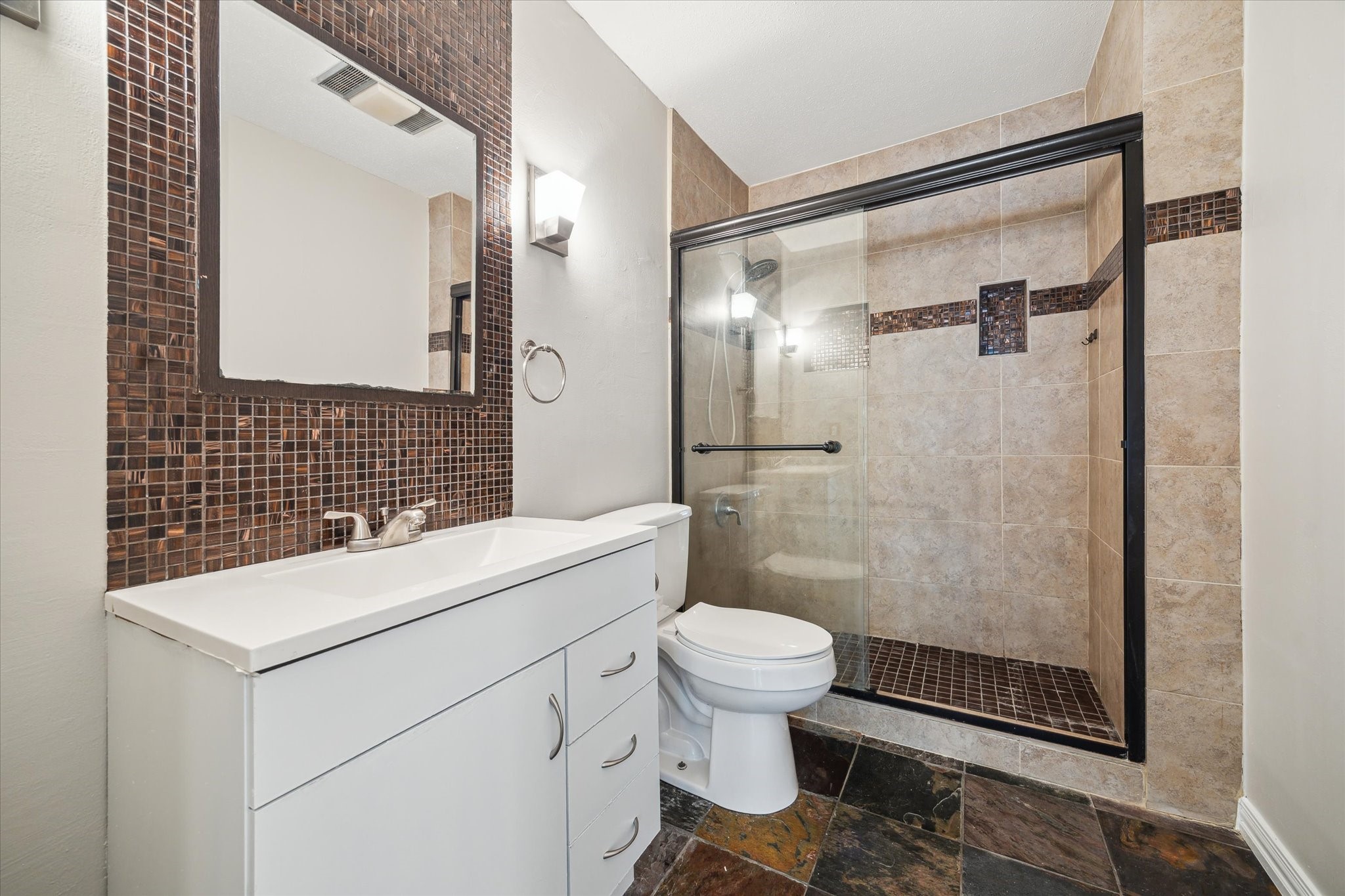 2277 South Kirkwood Road, Unit 914 Houston, TX 77077 - Photo 8 of 9 a bathroom with a sink toilet and shower