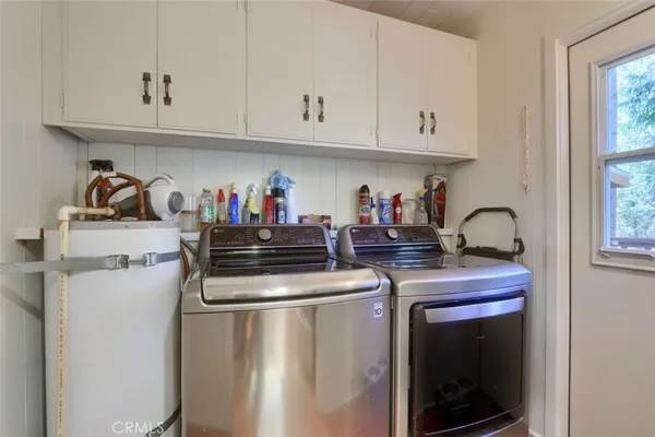 a kitchen with stainless steel appliances granite countertop a sink and cabinets