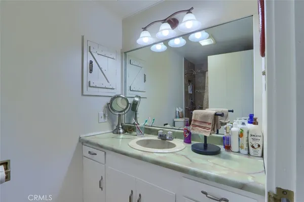 a bathroom with a sink and a mirror