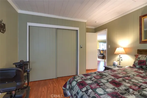 a bedroom with a bed and a table in it