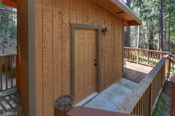 a view of a porch with wooden floor and stairs