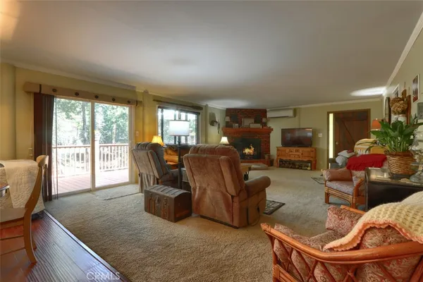 a living room with furniture a couch and large windows