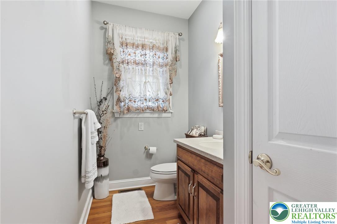 5217 Cider Press Road Schnecksville, PA 18078 - Photo 22 of 54 a bathroom with a toilet a sink and a mirror