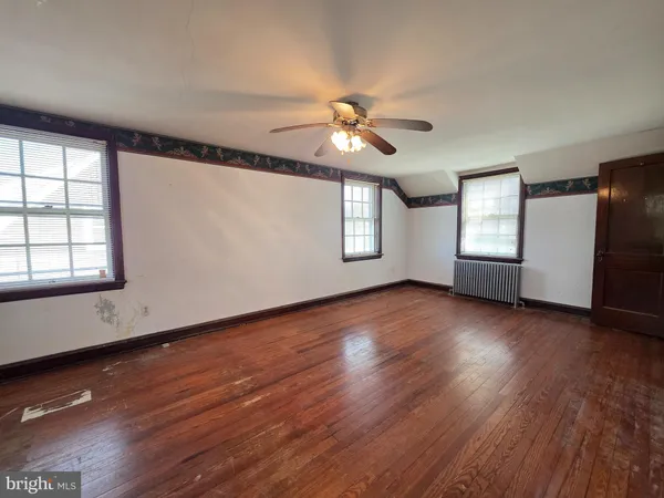 a view of livingroom with hardwood floor and hallway