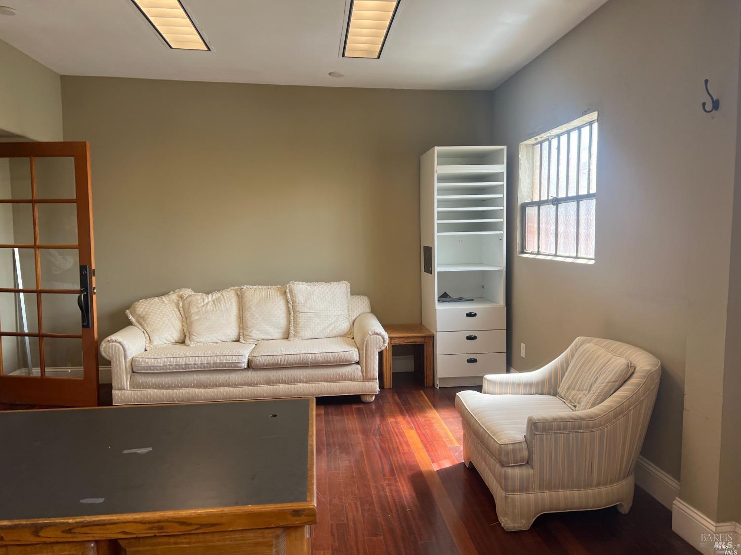 1029 Tennessee Street Vallejo, CA 94590 - Photo 13 of 19 a living room with furniture and a wooden floor