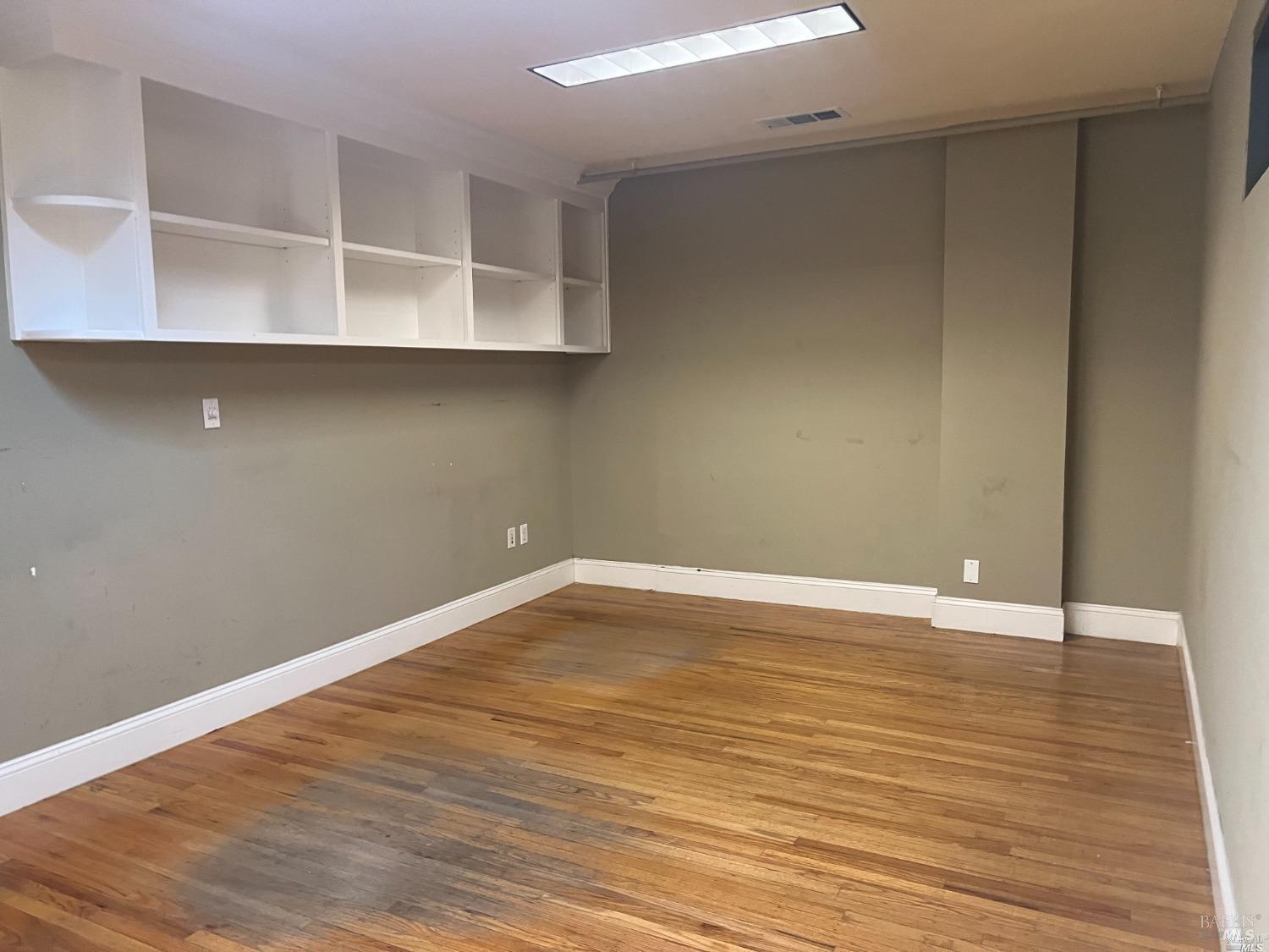 1029 Tennessee Street Vallejo, CA 94590 - Photo 7 of 19 a view of an empty room with wooden floor