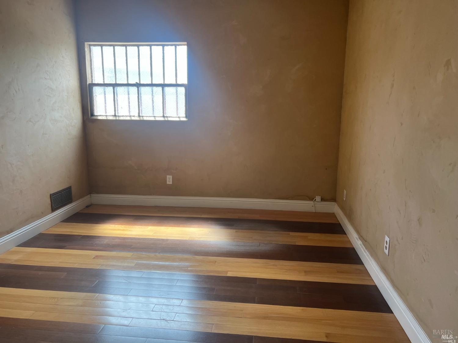 1029 Tennessee Street Vallejo, CA 94590 - Photo 10 of 19 a view of a room with wooden floor and window