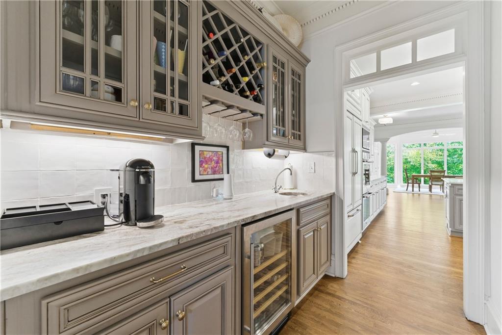 2918 Major Ridge Trail Duluth, GA 30097 - Photo 12 of 70 a kitchen with stainless steel appliances granite countertop a sink and wooden cabinets