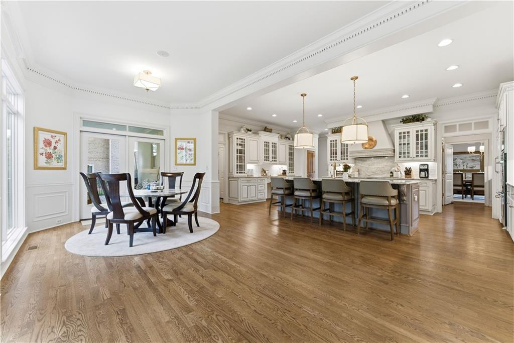 2918 Major Ridge Trail Duluth, GA 30097 - Photo 18 of 70 a view of a dining room and livingroom with furniture wooden floor and a chandelier