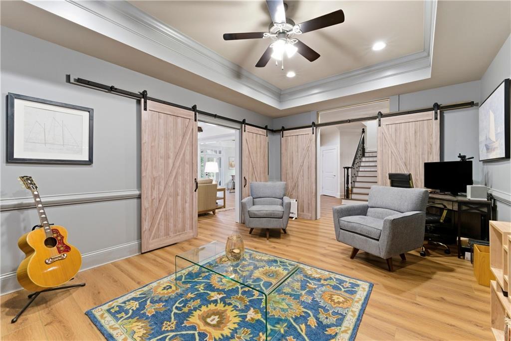 2918 Major Ridge Trail Duluth, GA 30097 - Photo 25 of 70 a living room with furniture and a flat screen tv