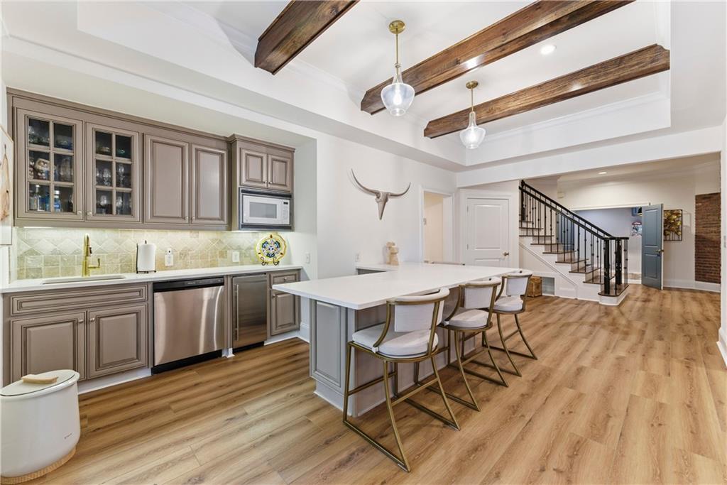2918 Major Ridge Trail Duluth, GA 30097 - Photo 27 of 70 a kitchen with a sink cabinets and wooden floor