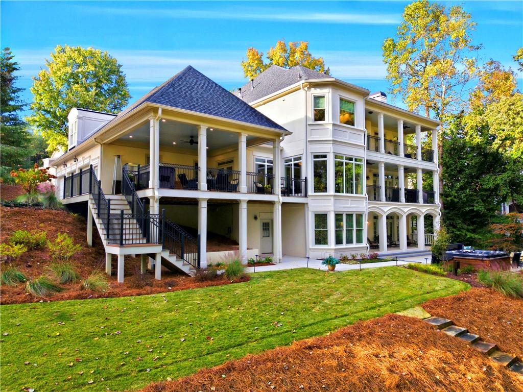 2918 Major Ridge Trail Duluth, GA 30097 - Photo 4 of 70 a front view of a house with a yard table and chairs