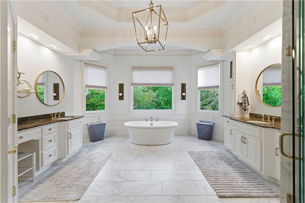 2918 Major Ridge Trail Duluth, GA 30097 - Photo 42 of 70 a bathroom with a bathtub sink mirror and window