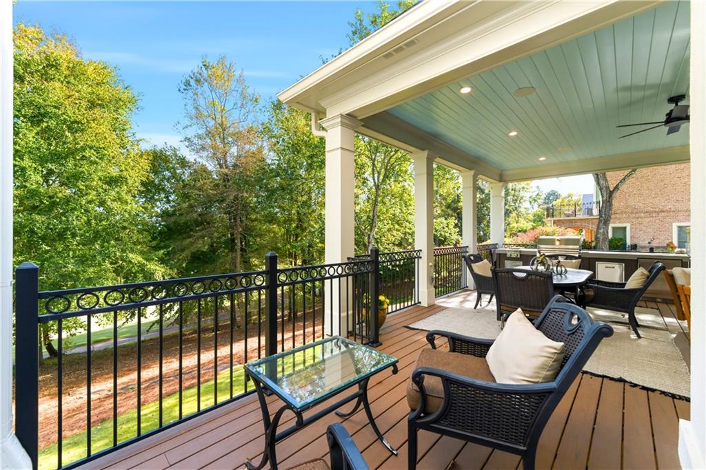 2918 Major Ridge Trail Duluth, GA 30097 - Photo 48 of 70 a view of a chairs and table in patio next to a yard