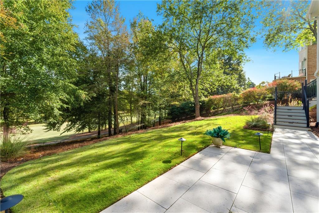 2918 Major Ridge Trail Duluth, GA 30097 - Photo 52 of 70 a view of yard with swimming pool and green space