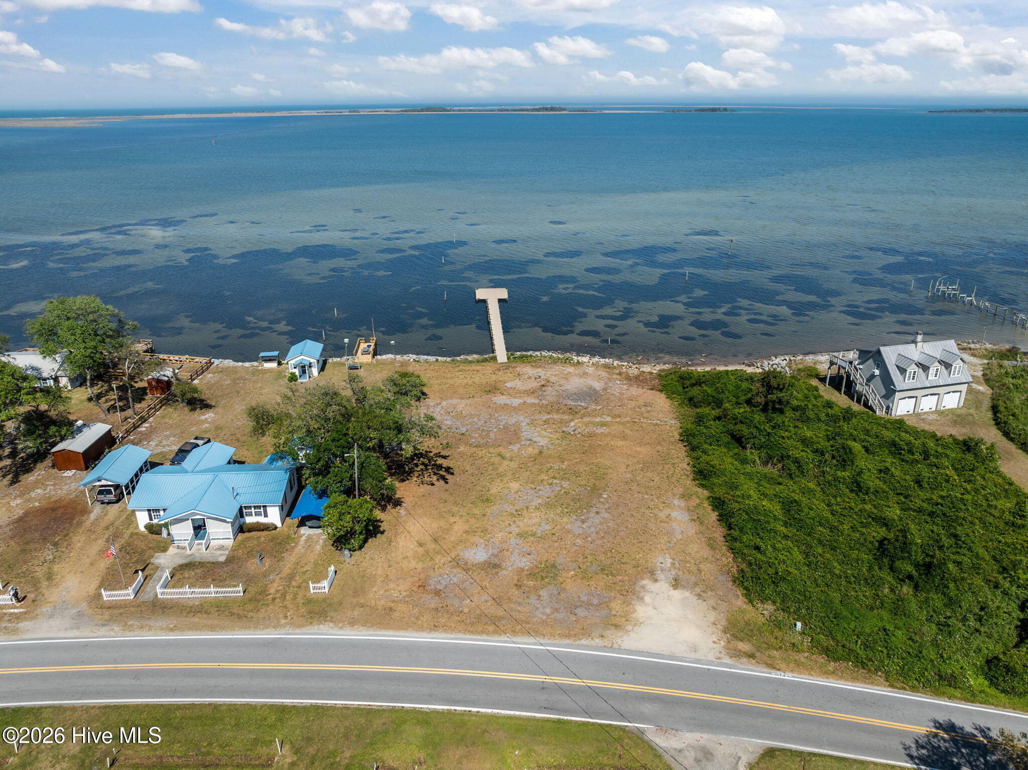 2472 Cedar Island Road Cedar Island, NC 28520 - Photo 31 of 33 AI-enhanced/virtually modified image for visualization purposes only. Property condition differs; structure currently exists on the lot.
