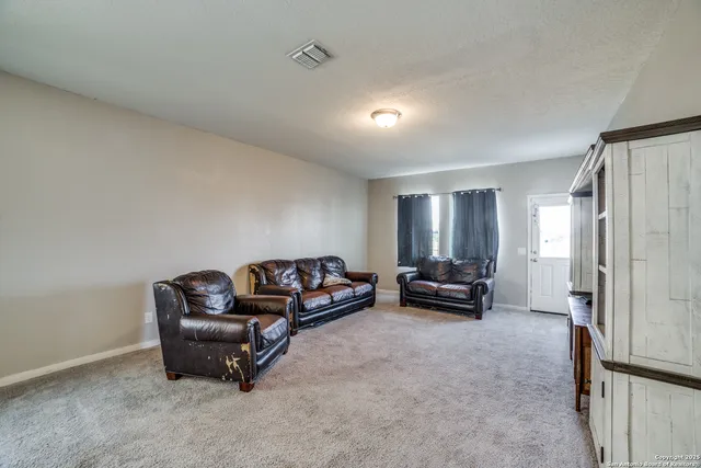 a living room with furniture and a couch
