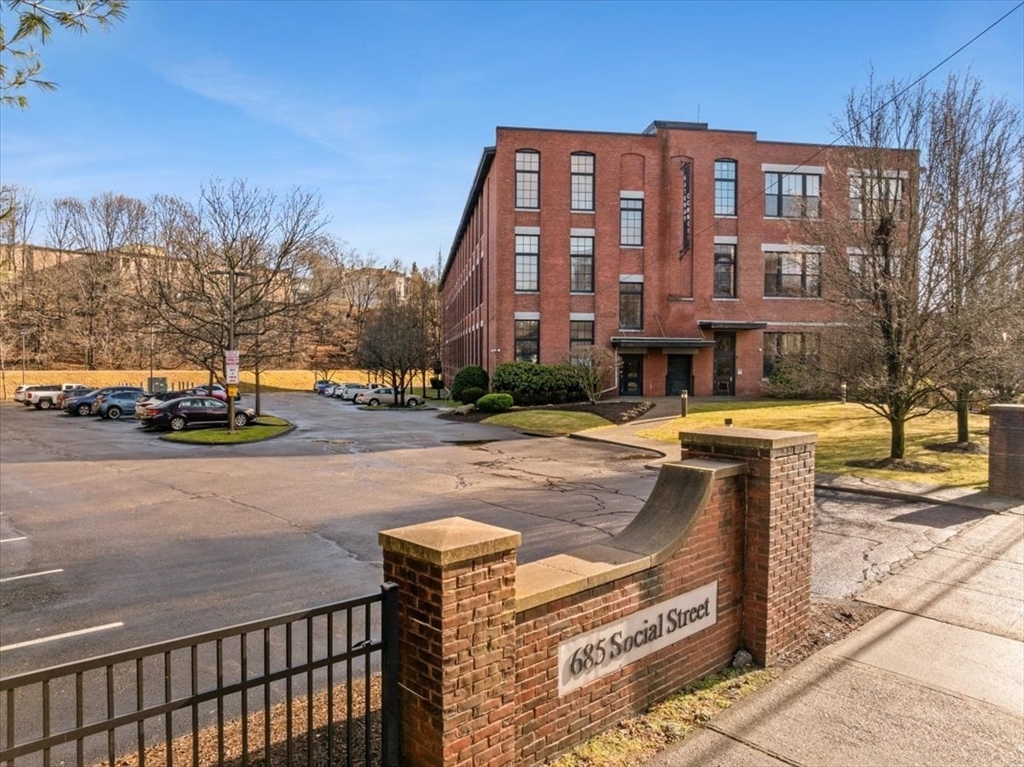 685 Social Street, Unit 215 Woonsocket, RI 02895 - Photo 11 of 40 a street view along with residential houses